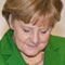 Bundeskanzlerin Angela Merkel trägt sich in das Goldene Buch der digitalen Stadt "Neustadt" von Microsoft ein.