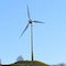 Wie einst auf dem Hügel Golgatha streckt die Windkraftanlage Grüner Heiner ihre Windräder gen Himmel und harrt der Transsubstantiation in eine leistungsfähigere Anlage.